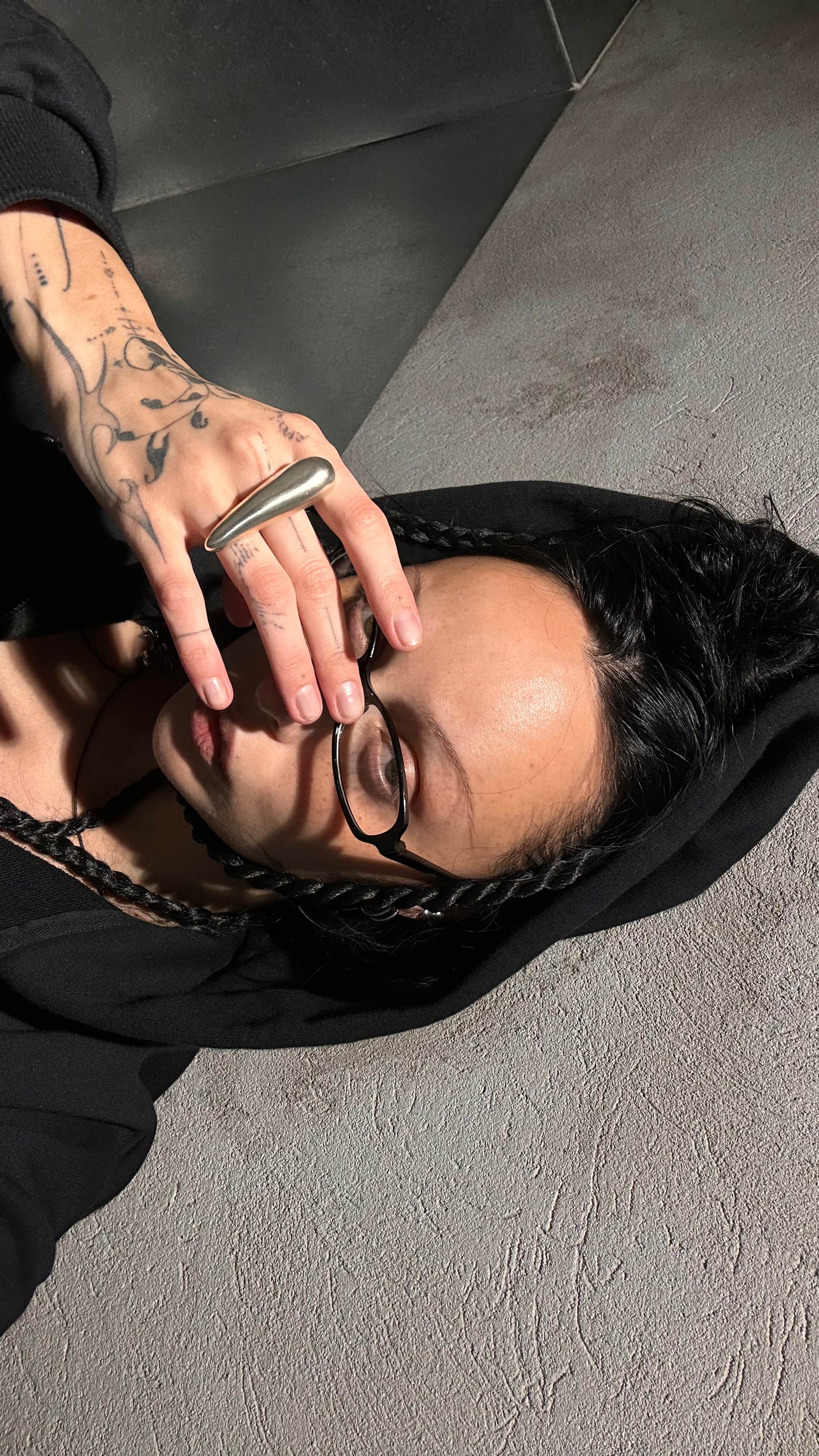 Woman wearing a black hoodie and chunky silver 925 ring
